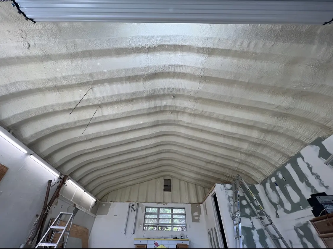 Spray polyurethane foam applied to the underside of a metal roof deck in Sweetwater